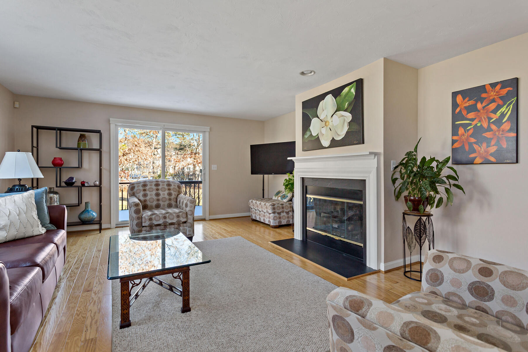 30 Bonwood Drive Mashpee, MA 02649 - Photo 11 of 23 a living room with furniture a flat screen tv and a fireplace