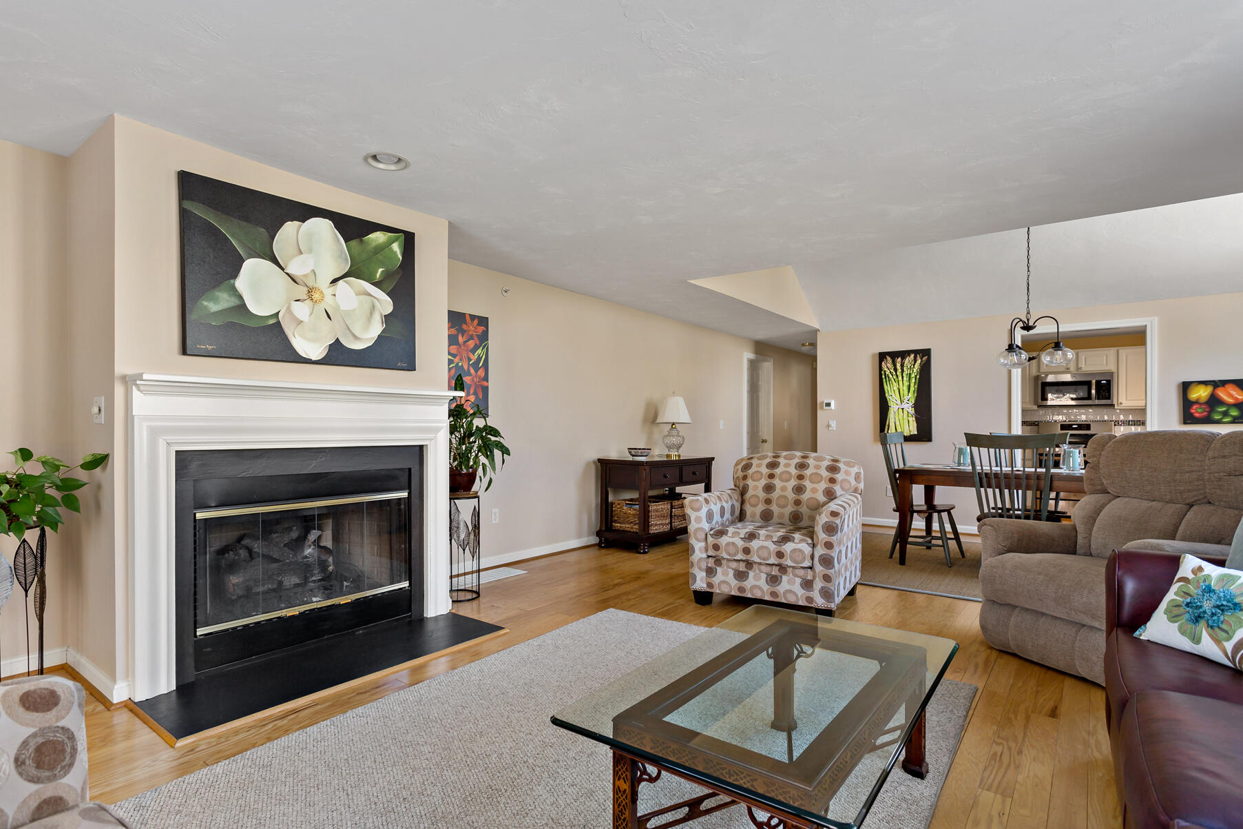 30 Bonwood Drive Mashpee, MA 02649 - Photo 13 of 23 a living room with furniture a fireplace and a table