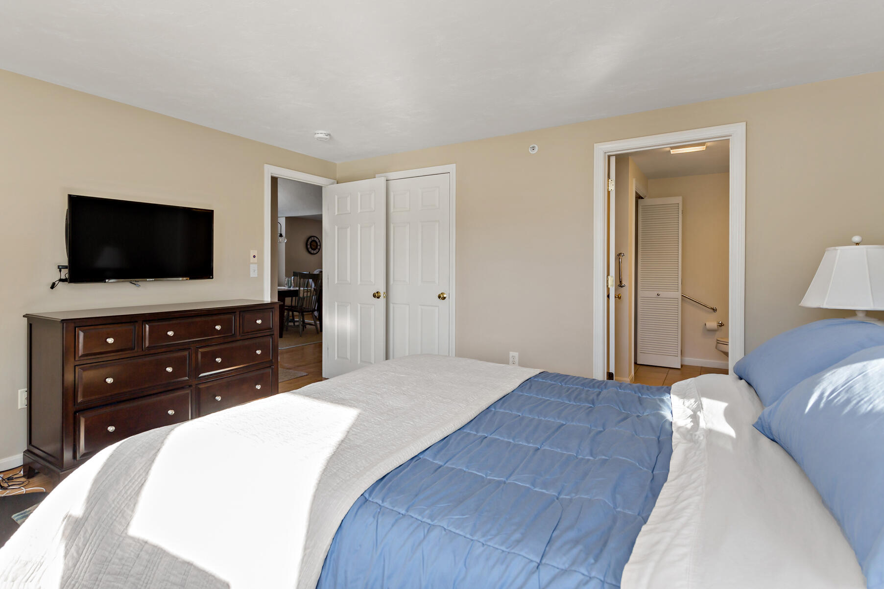 30 Bonwood Drive Mashpee, MA 02649 - Photo 15 of 23 a bedroom with a bed and a flat screen tv