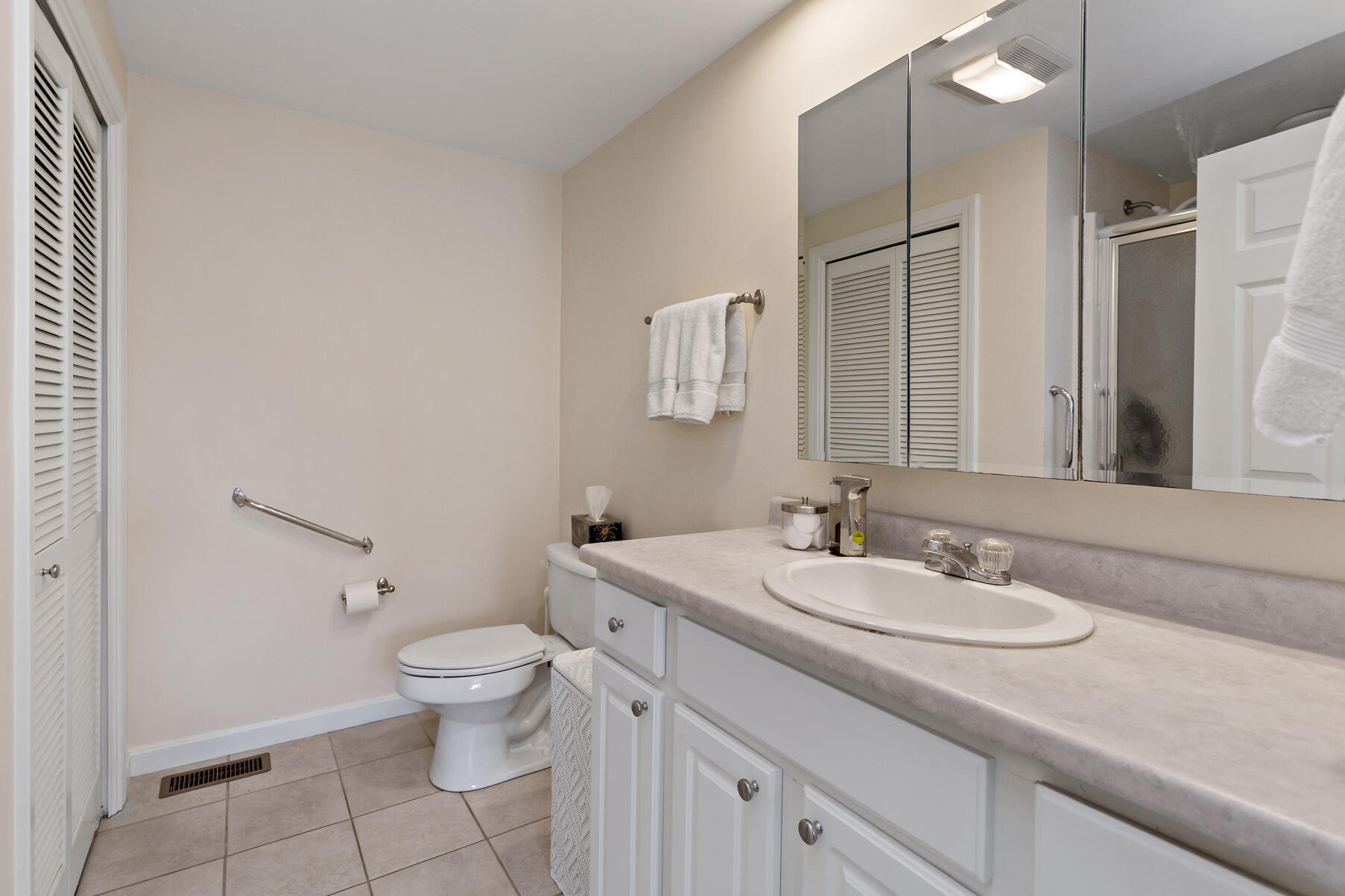 30 Bonwood Drive Mashpee, MA 02649 - Photo 16 of 23 a bathroom with a sink a toilet and a mirror