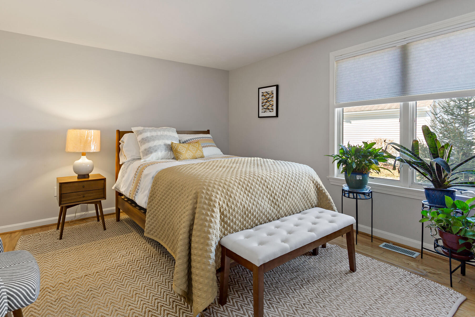 30 Bonwood Drive Mashpee, MA 02649 - Photo 18 of 23 a bedroom with a bed and a potted plant