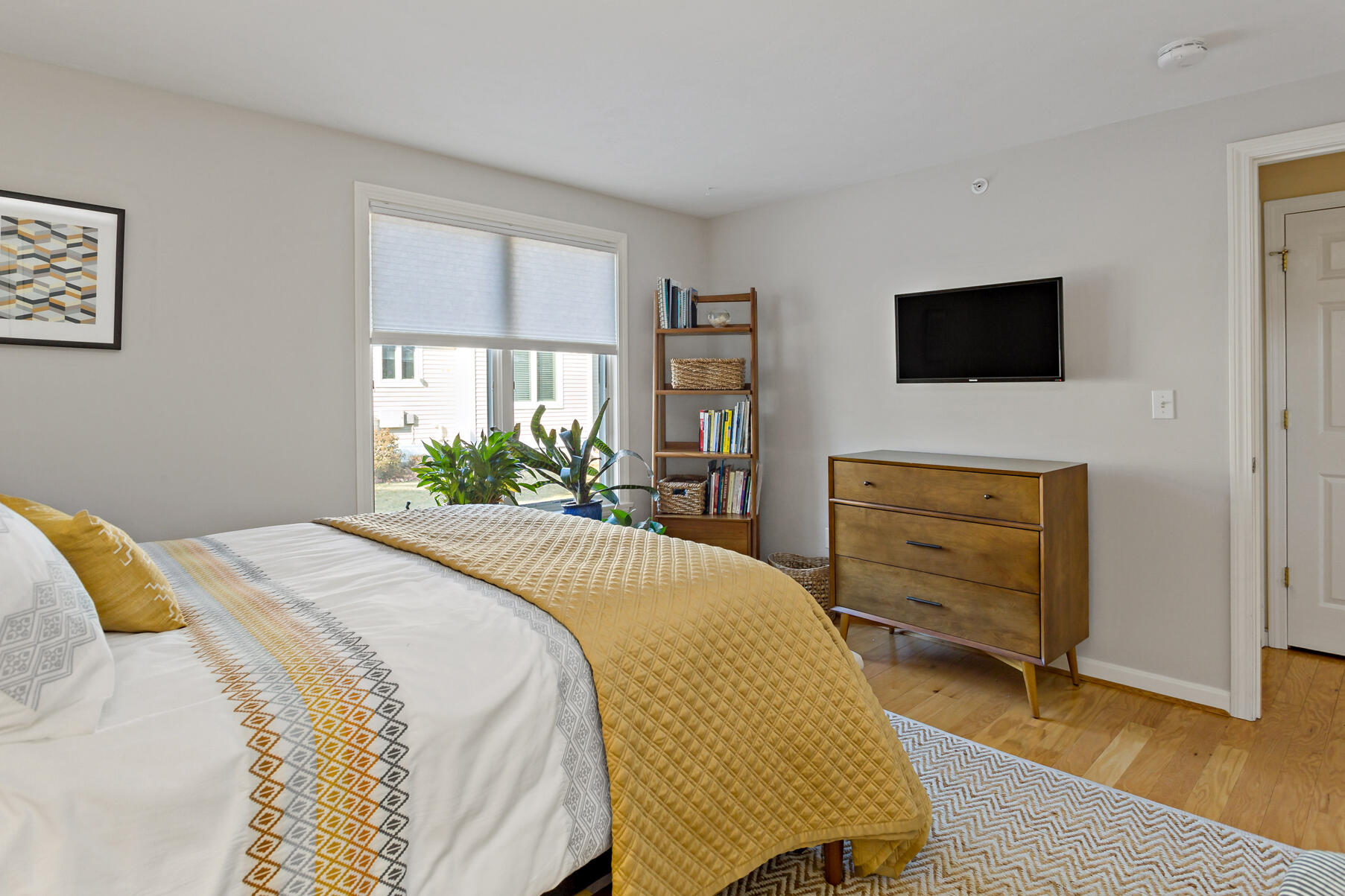 30 Bonwood Drive Mashpee, MA 02649 - Photo 19 of 23 a bedroom with a bed and a television