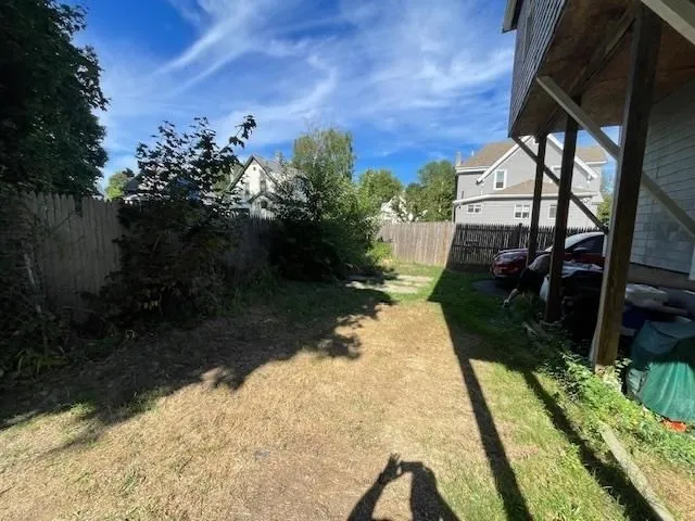 a view of backyard with seating space