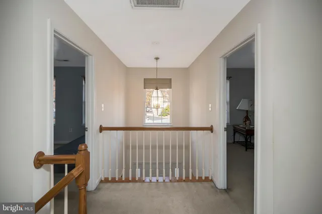 a bedroom with a bed and couch