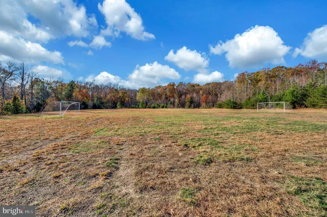 a view of a park with swings and slides