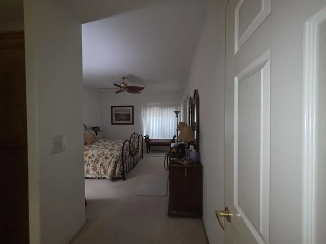 a bed room with a bed and a window