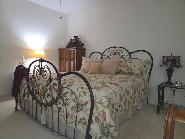 a view of walk in closet with clothes