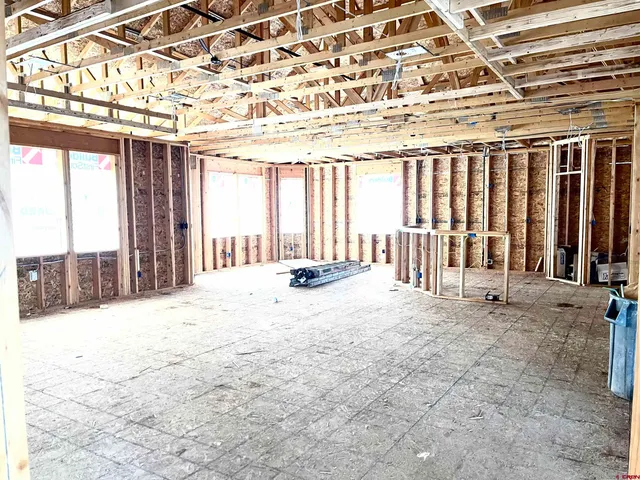 a view of a building with wooden fence