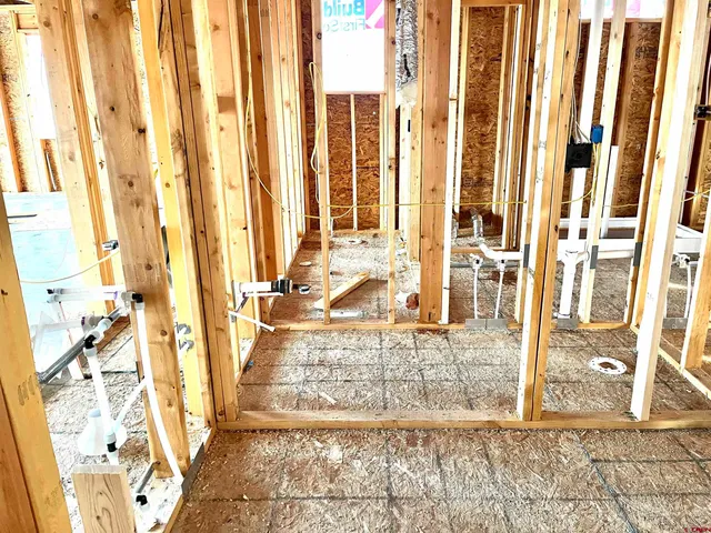 a view of front door of house with outdoor seating