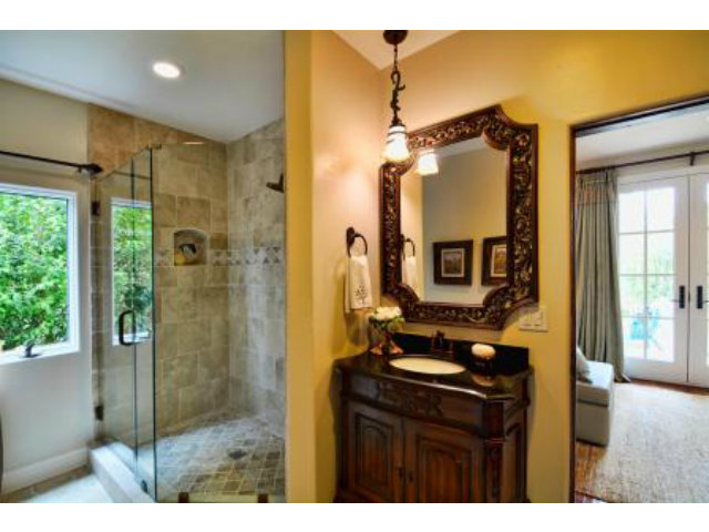 24337 San Juan Road Carmel, CA 93923 - Photo 19 of 25 a bathroom with a sink mirror and shower