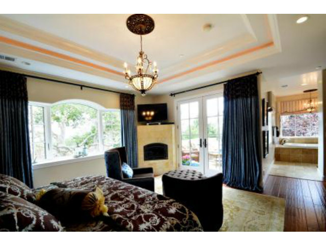 24337 San Juan Road Carmel, CA 93923 - Photo 20 of 25 a living room with fireplace furniture and a chandelier
