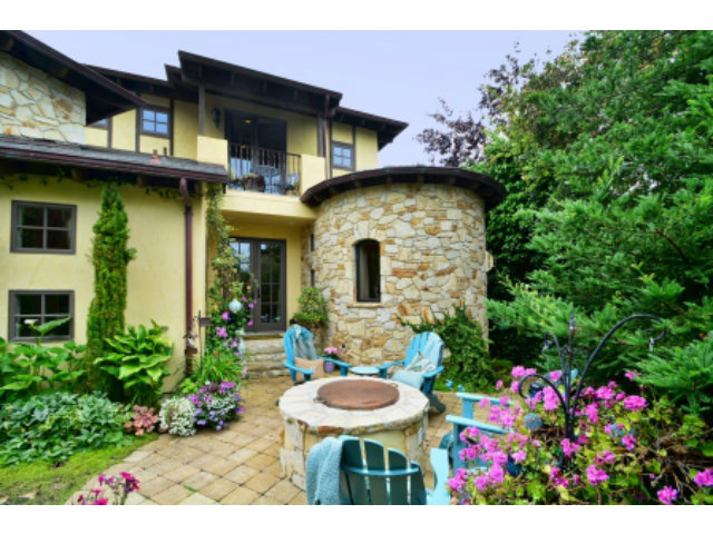 24337 San Juan Road Carmel, CA 93923 - Photo 4 of 25 a view of a chair and tables in the patio front of house