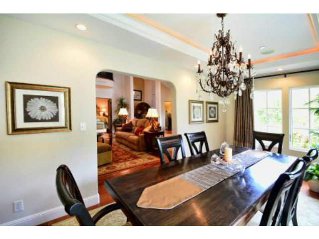 24337 San Juan Road Carmel, CA 93923 - Photo 8 of 25 a living room with furniture a chandelier a large window and a chandelier