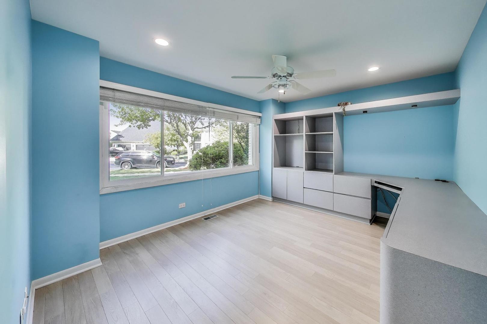 1903 Sheridan Road Buffalo Grove, IL 60089 - Photo 11 of 33 a view of empty room with wooden floor and fan