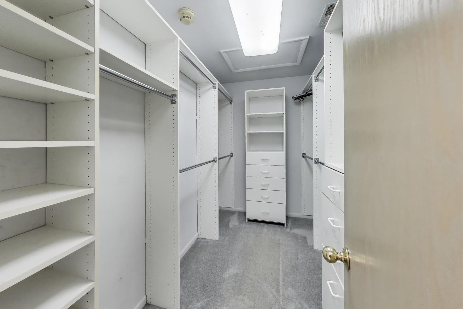1903 Sheridan Road Buffalo Grove, IL 60089 - Photo 15 of 33 a view of walk in closet with empty racks