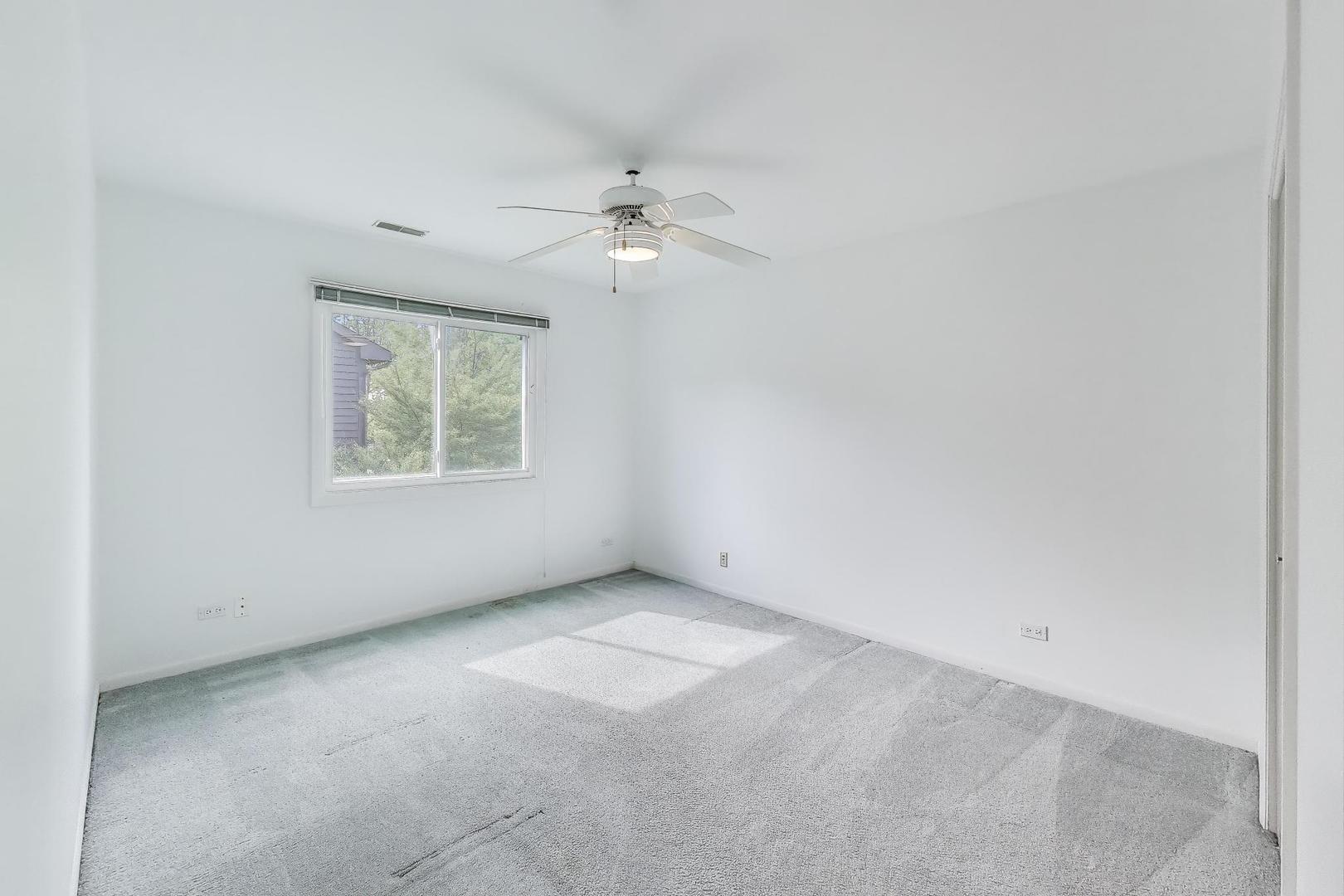 1903 Sheridan Road Buffalo Grove, IL 60089 - Photo 18 of 33 an empty room with windows and fan