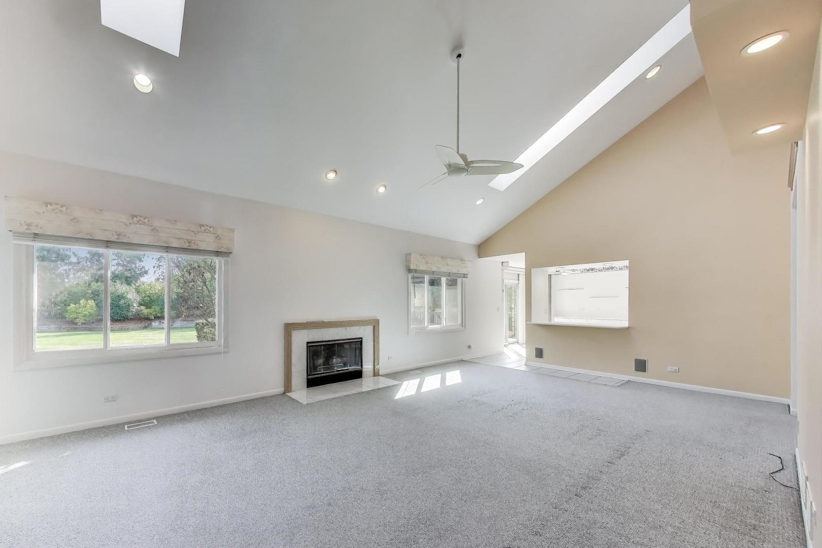 1903 Sheridan Road Buffalo Grove, IL 60089 - Photo 2 of 33 a view of empty room with fireplace and windows