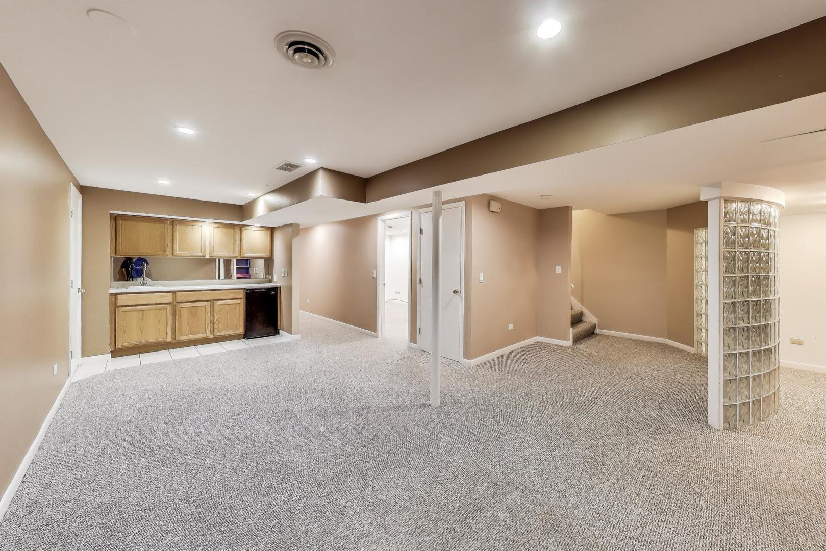 1903 Sheridan Road Buffalo Grove, IL 60089 - Photo 21 of 33 a view of a kitchen with a sink and a refrigerator