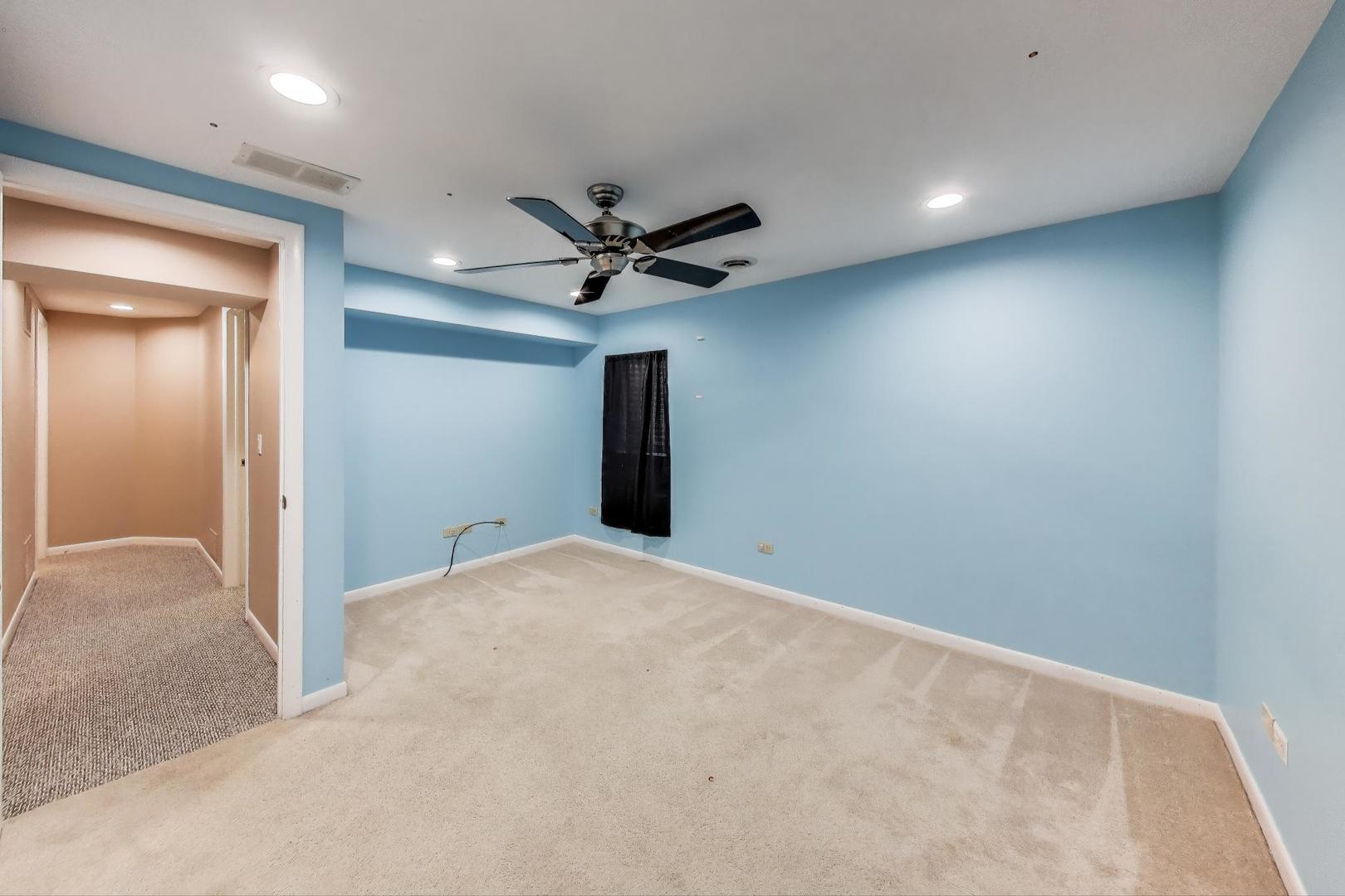1903 Sheridan Road Buffalo Grove, IL 60089 - Photo 26 of 33 a view of a livingroom with a ceiling fan