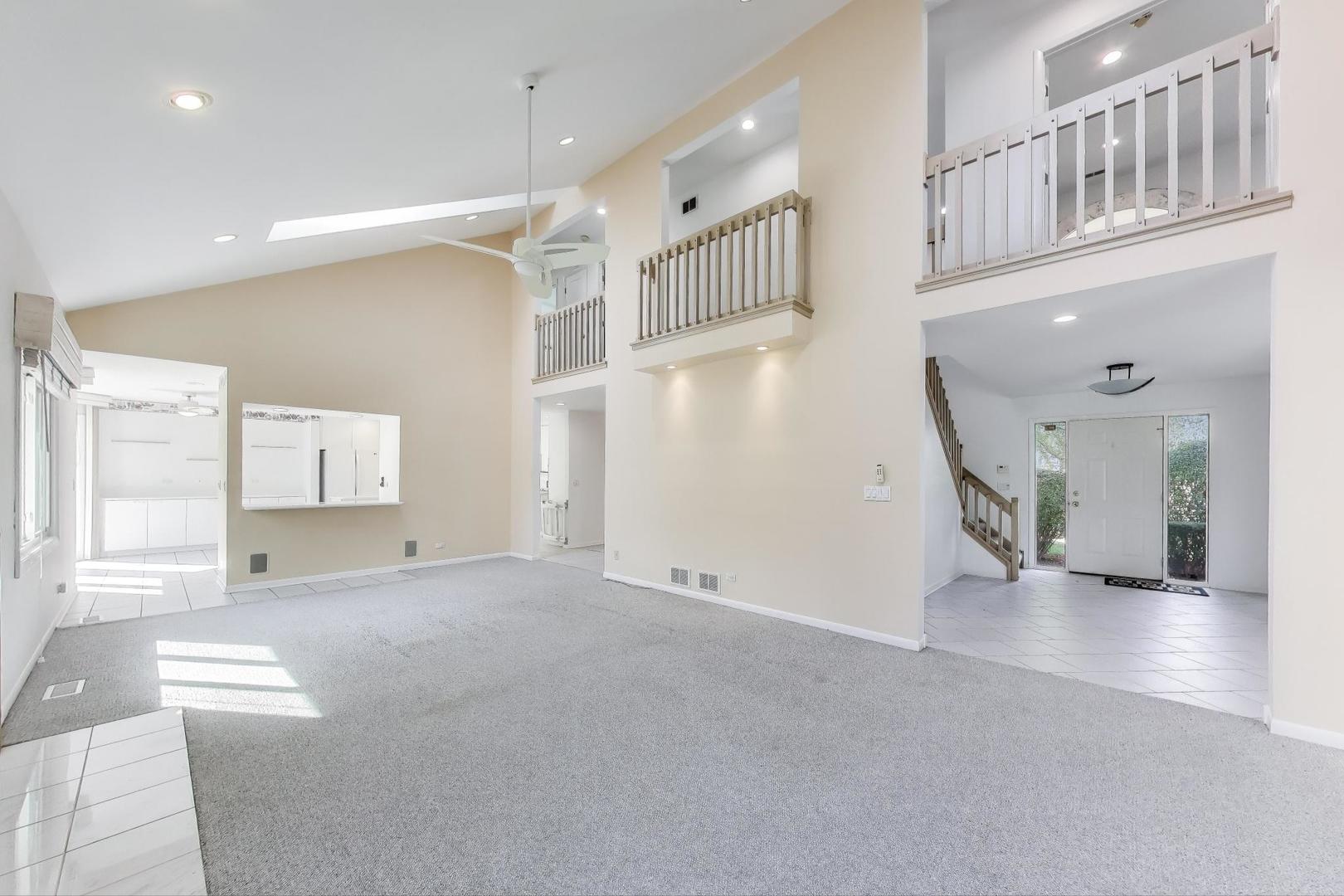1903 Sheridan Road Buffalo Grove, IL 60089 - Photo 3 of 33 a view of an entryway with wooden floor