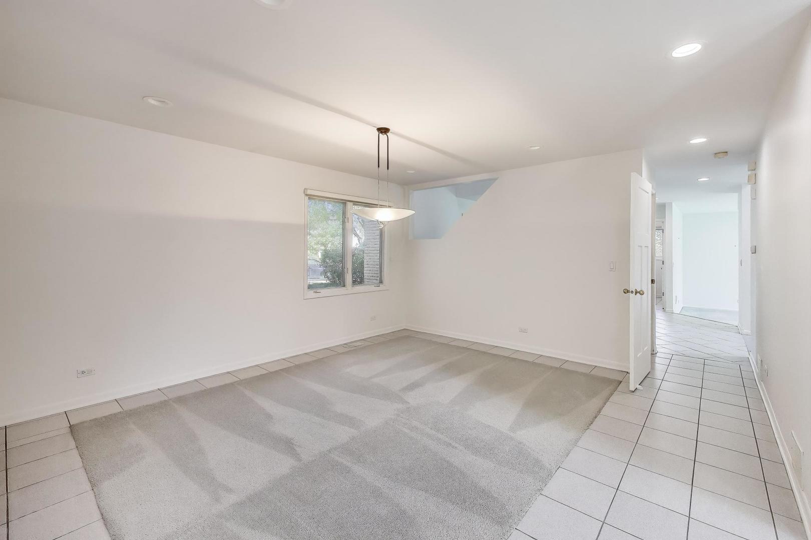 1903 Sheridan Road Buffalo Grove, IL 60089 - Photo 6 of 33 an empty room with fan and windows