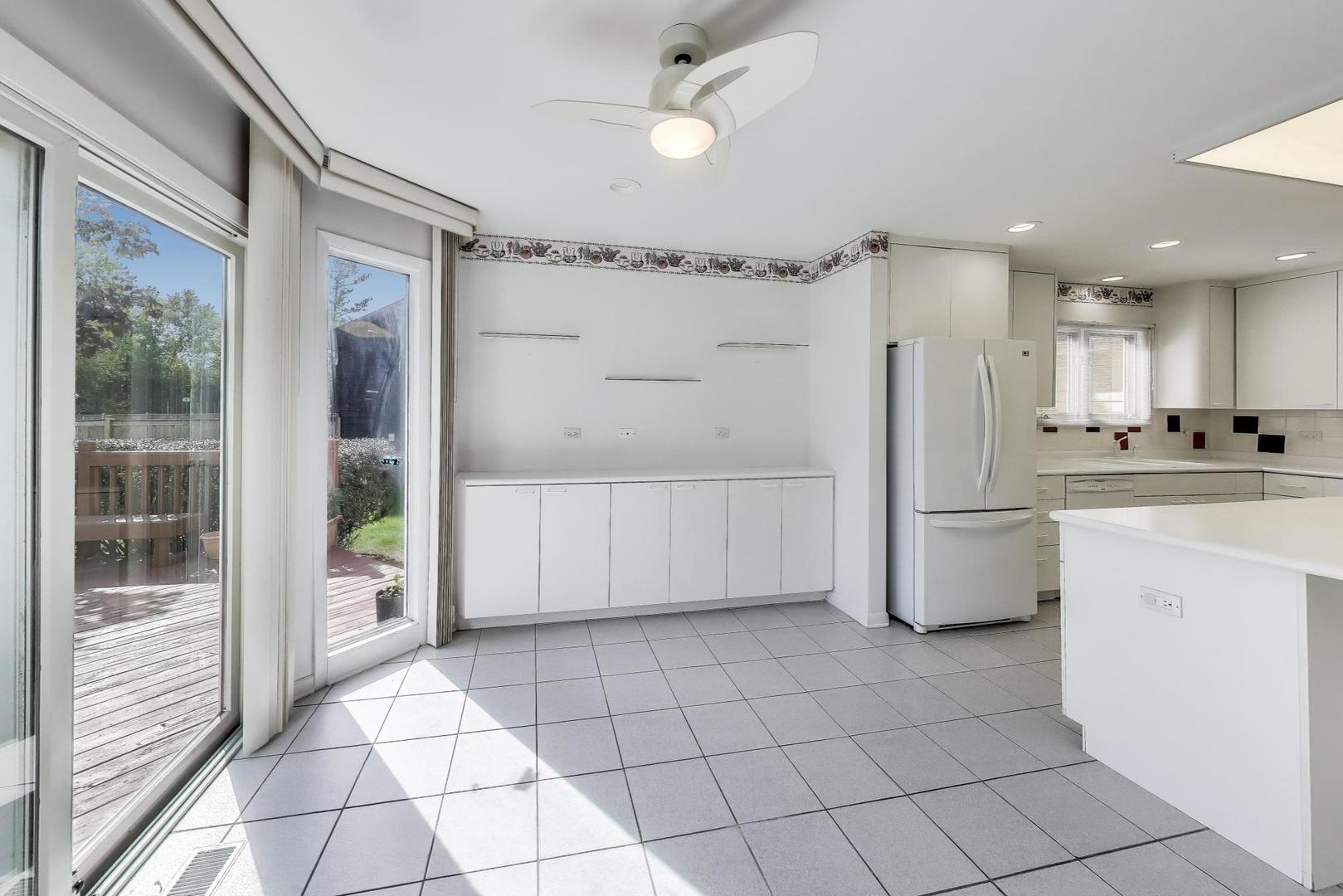 1903 Sheridan Road Buffalo Grove, IL 60089 - Photo 10 of 33 a kitchen with white cabinets and refrigerator