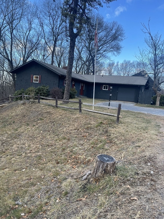 a house with trees in the background