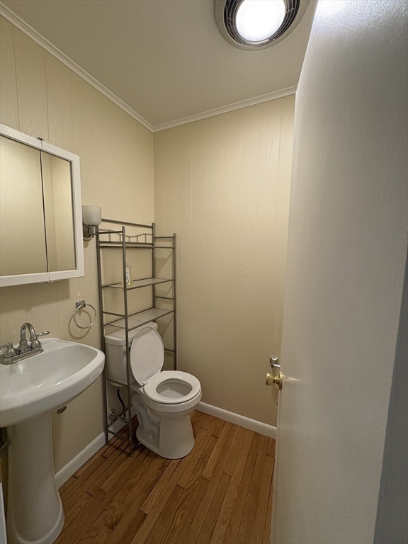 150 West Wrentham Road Cumberland, RI 02864 - Photo 13 of 38 a bathroom with a toilet a sink and mirror