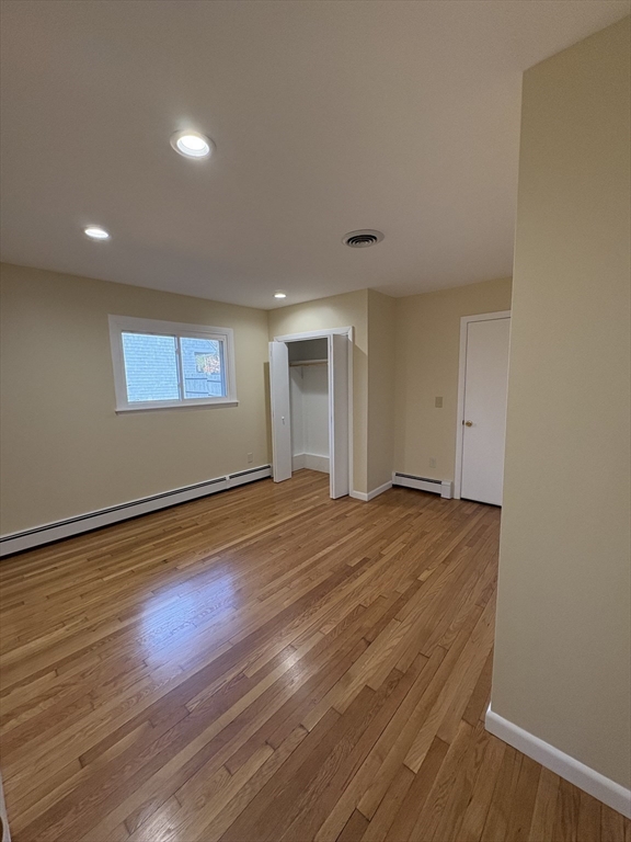 150 West Wrentham Road Cumberland, RI 02864 - Photo 14 of 38 a view of empty room with wooden floor and fan