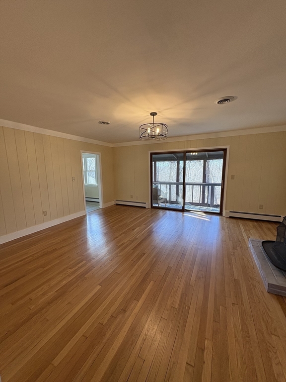 150 West Wrentham Road Cumberland, RI 02864 - Photo 7 of 38 a view of an empty room with wooden floor and a window