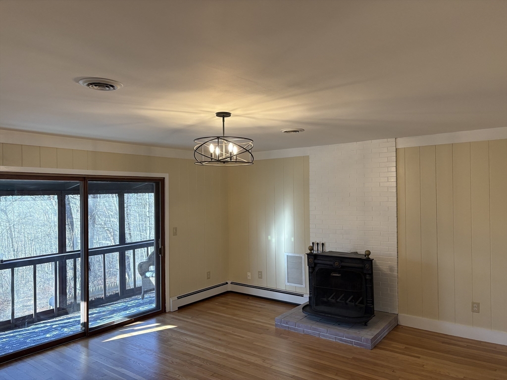 150 West Wrentham Road Cumberland, RI 02864 - Photo 8 of 38 a view of empty room with wooden floor and fan