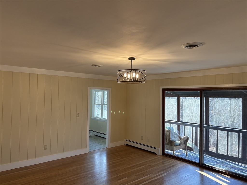 150 West Wrentham Road Cumberland, RI 02864 - Photo 9 of 38 a view of livingroom with hardwood floor and hallway