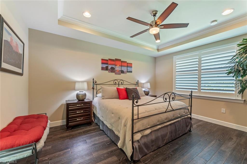 20191 Torch Key Way Estero, FL 33928 - Photo 14 of 39 a bedroom with a bed and a couch