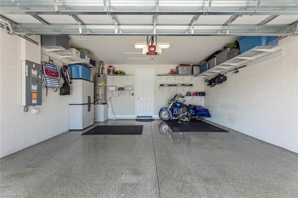 20191 Torch Key Way Estero, FL 33928 - Photo 23 of 39 a view of a garage with storage