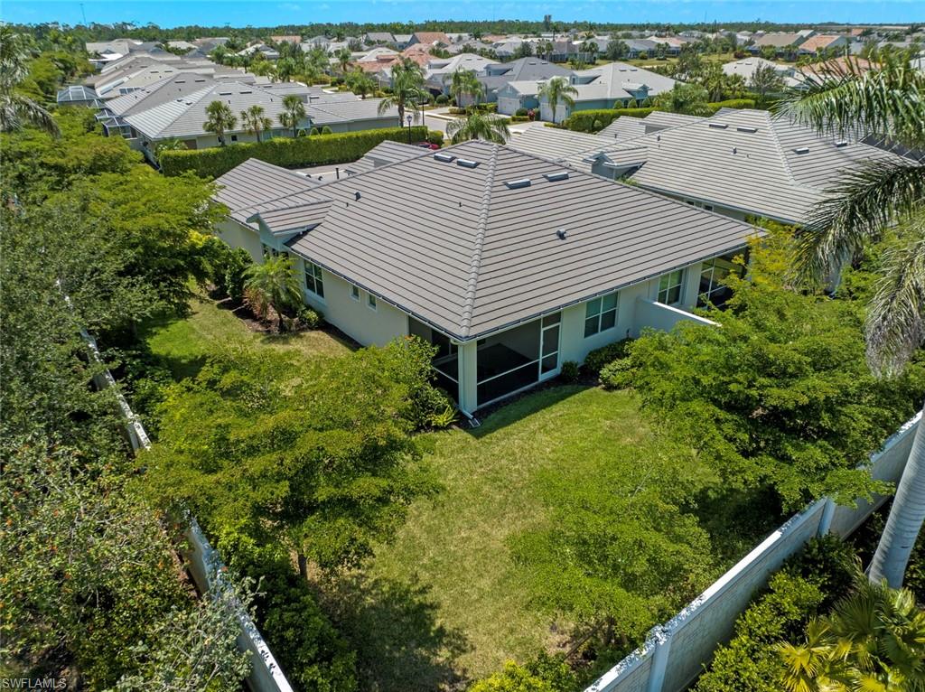 20191 Torch Key Way Estero, FL 33928 - Photo 29 of 39 an aerial view of a house having yard