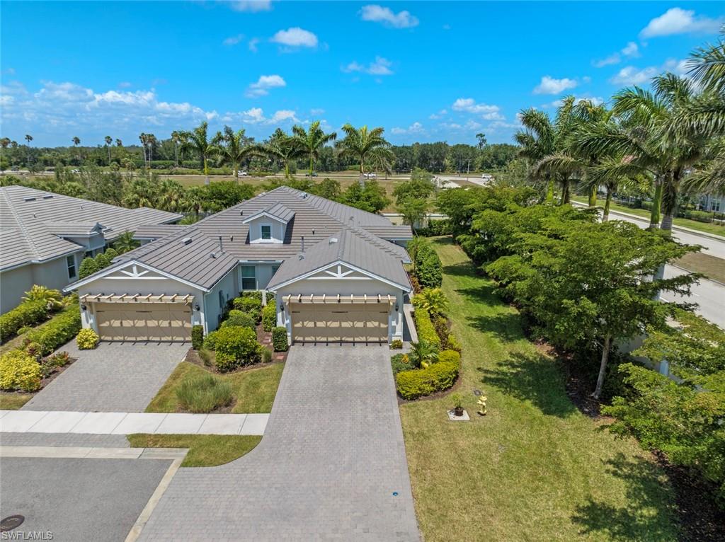 20191 Torch Key Way Estero, FL 33928 - Photo 31 of 39 an aerial view of a house with a garden