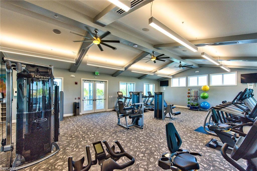 20191 Torch Key Way Estero, FL 33928 - Photo 36 of 39 a very nice looking room with gym equipment