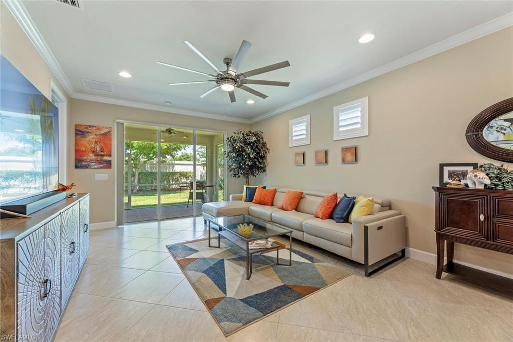 20191 Torch Key Way Estero, FL 33928 - Photo 7 of 39 a living room with furniture and a large window