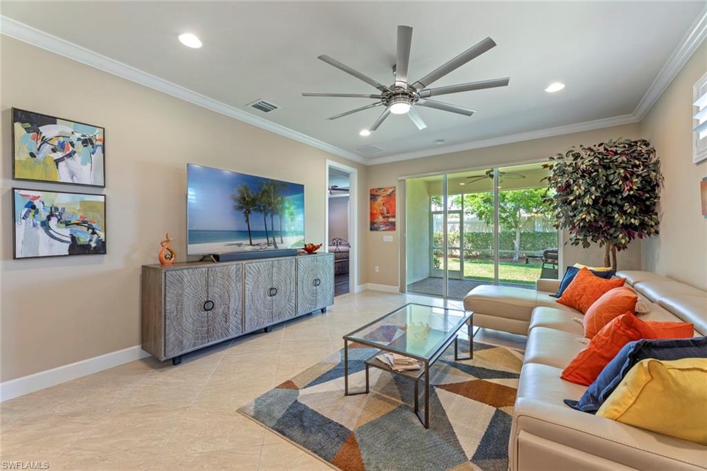 20191 Torch Key Way Estero, FL 33928 - Photo 8 of 39 a living room with furniture and a flat screen tv