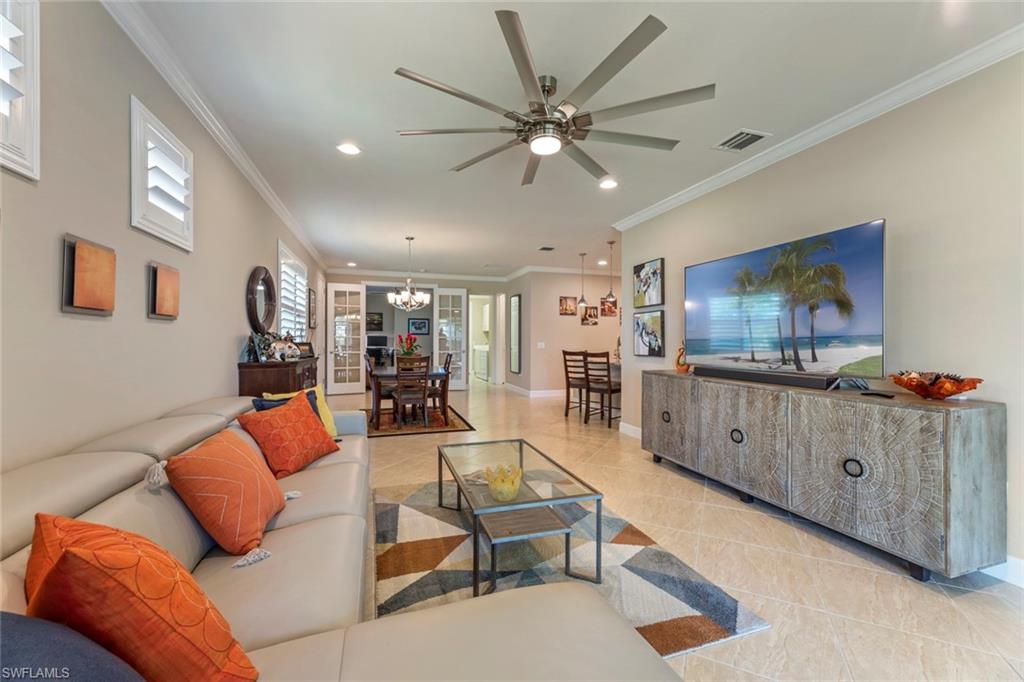 20191 Torch Key Way Estero, FL 33928 - Photo 10 of 39 a living room with furniture and a flat screen tv