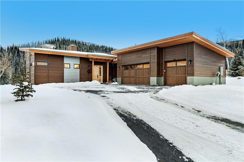 243 McKay Road Silverthorne, CO 80498 - Photo 2 of 16 a front view of a house with a yard