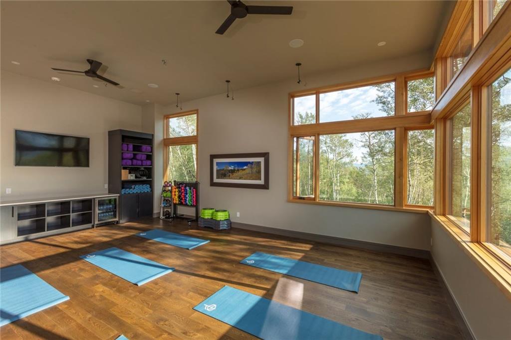 243 McKay Road Silverthorne, CO 80498 - Photo 16 of 16 a living room with stainless steel appliances furniture a rug and a large window