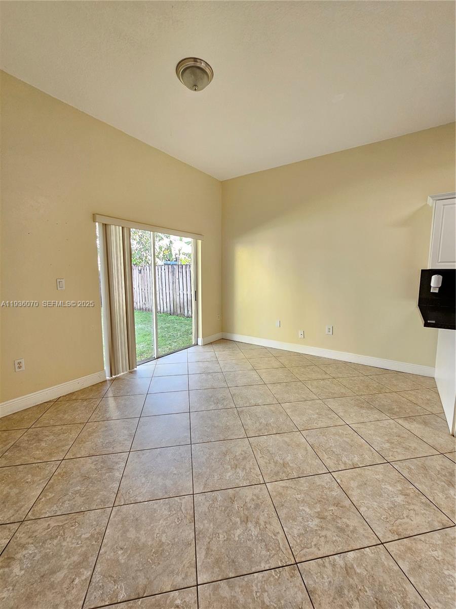 14209 Southwest 160th Court Miami, FL 33196 - Photo 11 of 24 a view of an empty room with a window