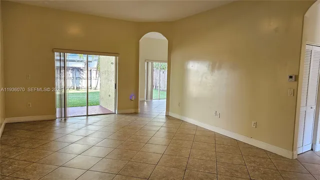 a view of a kitchen with a sink and cabinets