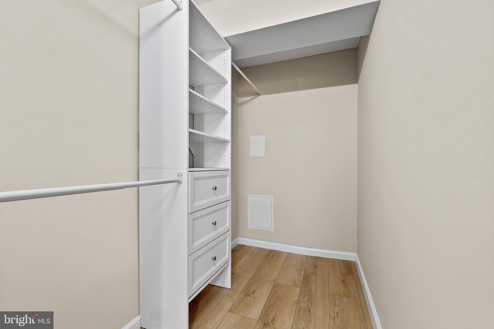 7661 Provincial Drive, Unit 112 McLean, VA 22102 - Photo 17 of 36 a view of walk in closet with empty racks
