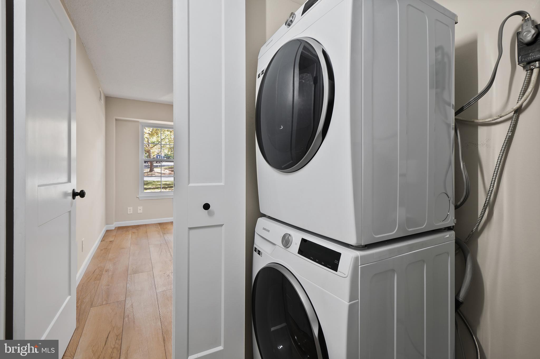 7661 Provincial Drive, Unit 112 McLean, VA 22102 - Photo 18 of 36 a view of a hallway with washer and dryer
