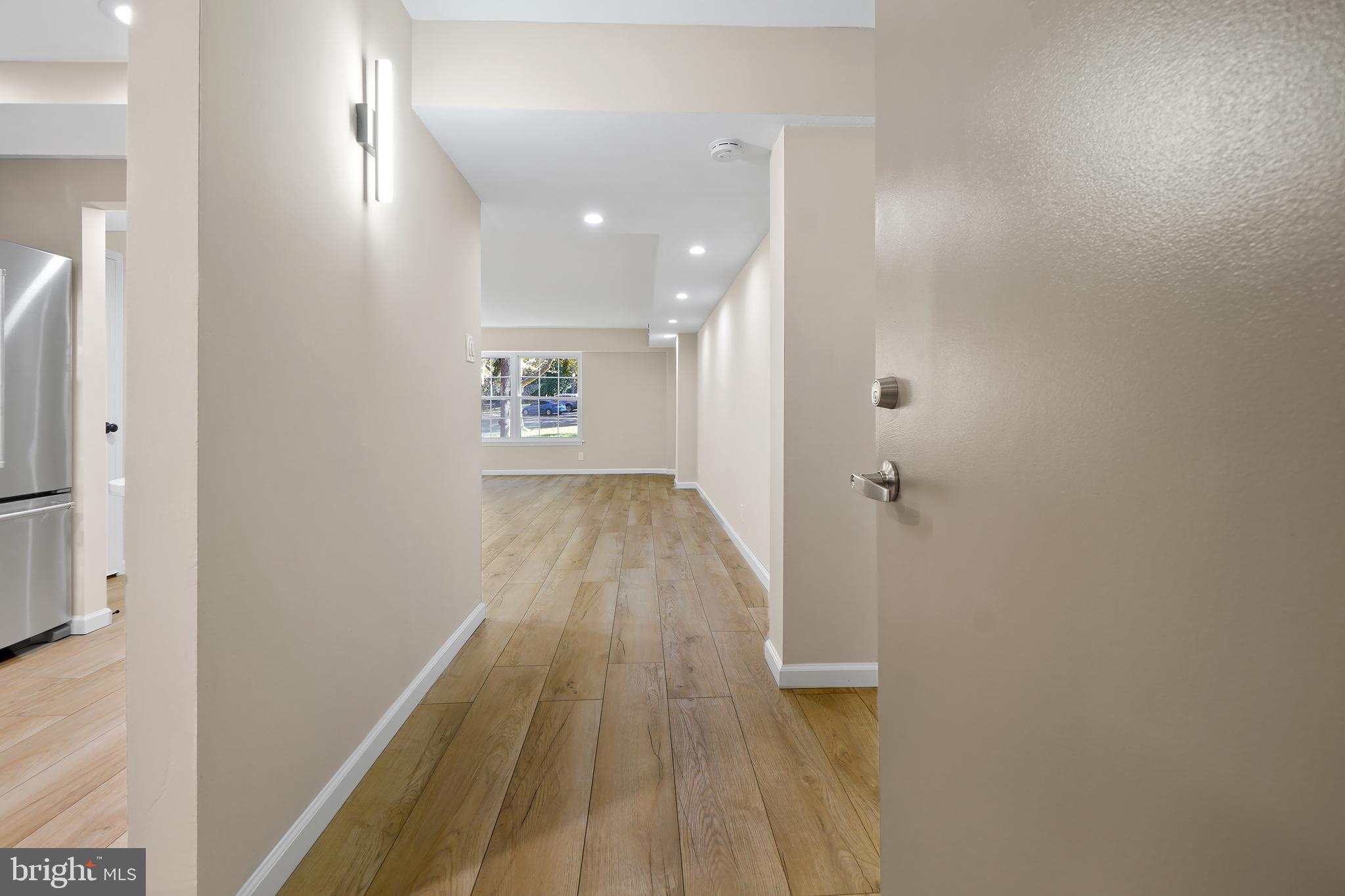 7661 Provincial Drive, Unit 112 McLean, VA 22102 - Photo 2 of 36 a view of hallway with wooden floor