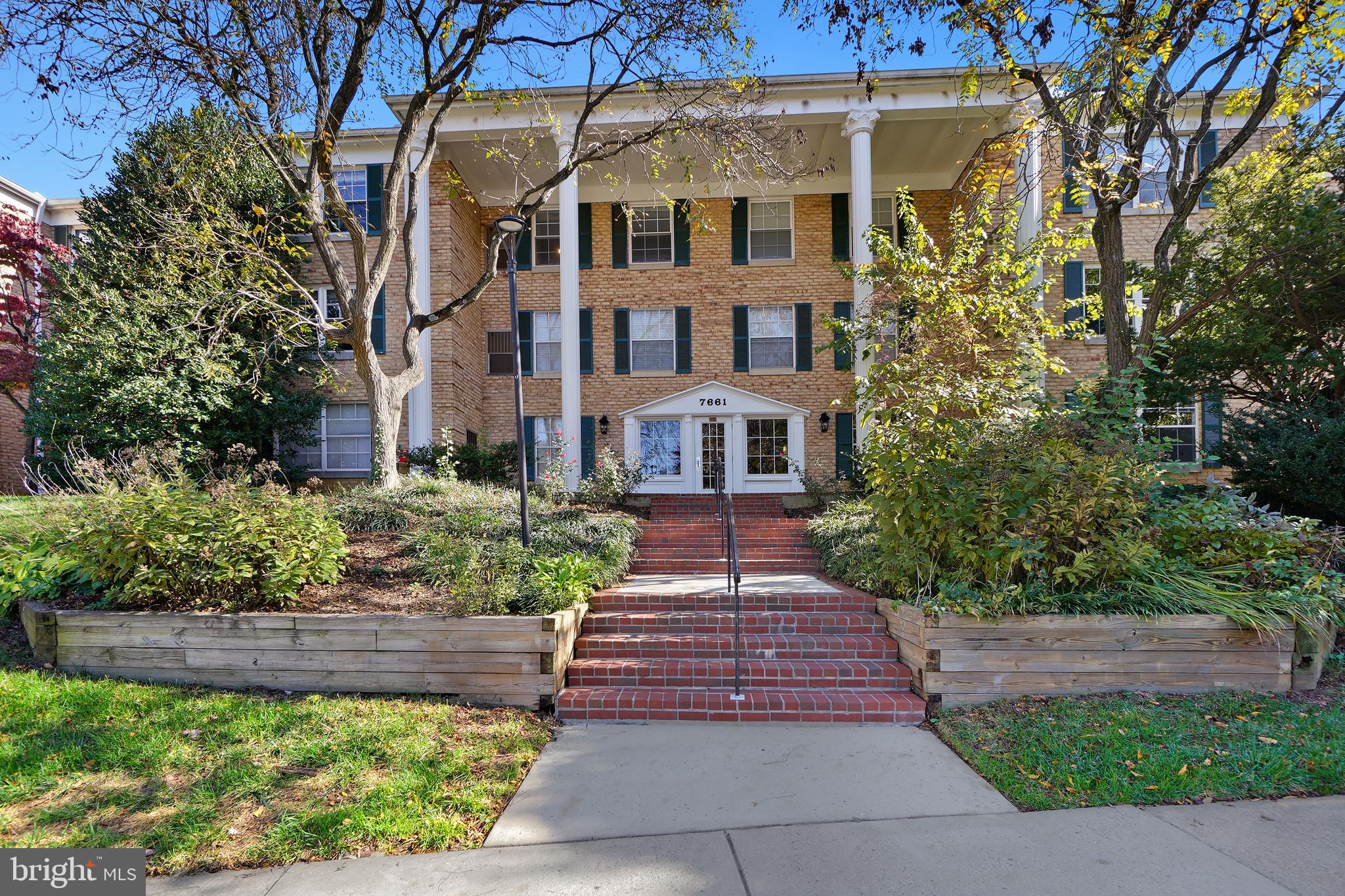 7661 Provincial Drive, Unit 112 McLean, VA 22102 - Photo 21 of 36 a front view of a house with a yard