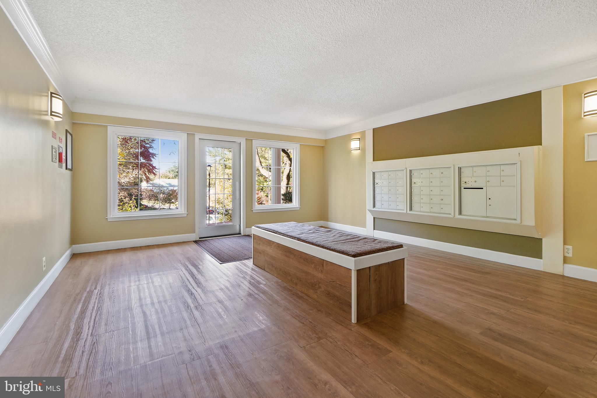 7661 Provincial Drive, Unit 112 McLean, VA 22102 - Photo 22 of 36 a living room with wooden floor and window