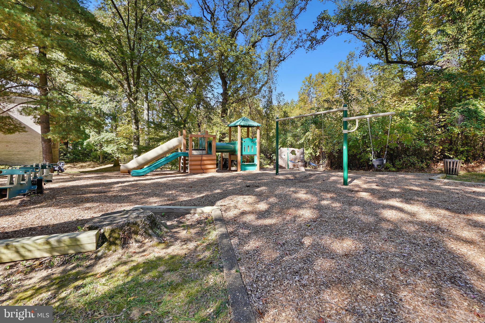 7661 Provincial Drive, Unit 112 McLean, VA 22102 - Photo 23 of 36 a view of outdoor space with garden and trees